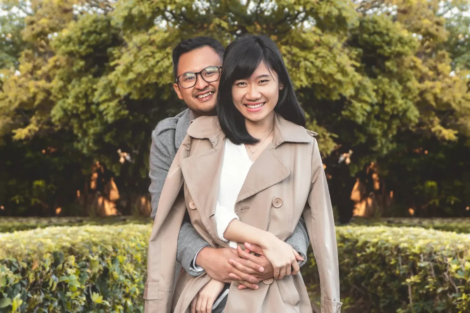 A couple smiling in a park