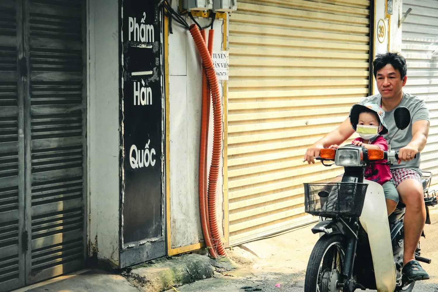 A father and his daughter on a scooter